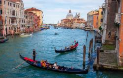 Gondolas on a canal in Venice Italy