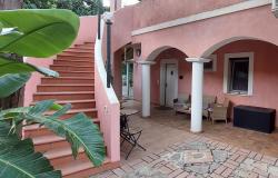 Porch and stairs leading to roof-top terrace