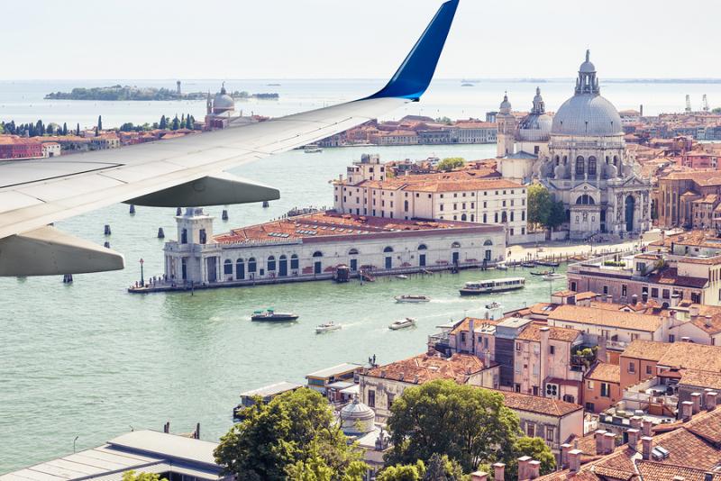 Plane flies above Venice