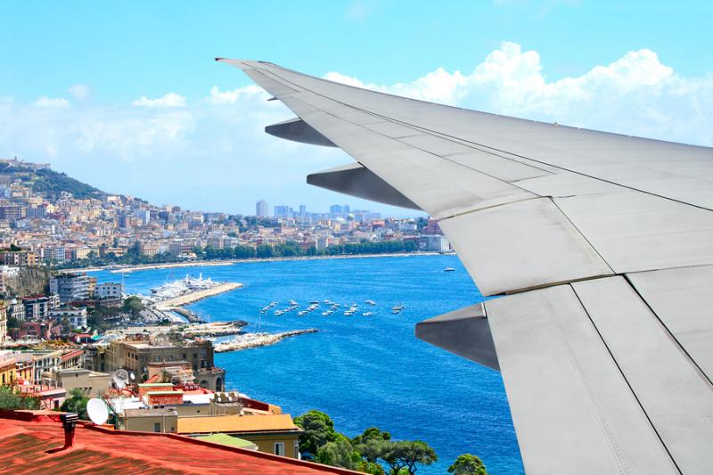 Plane flying over Naples Italy