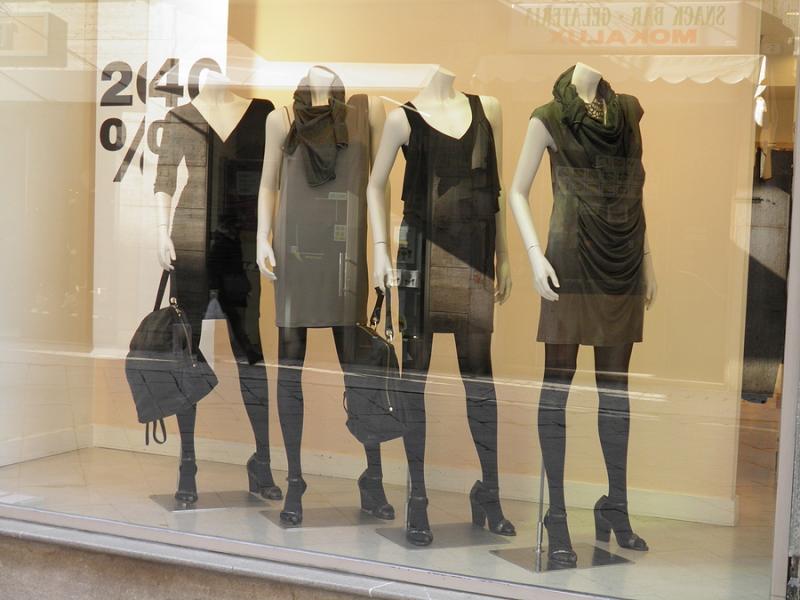 Female mannequins in shop window at Italian fashion boutique 