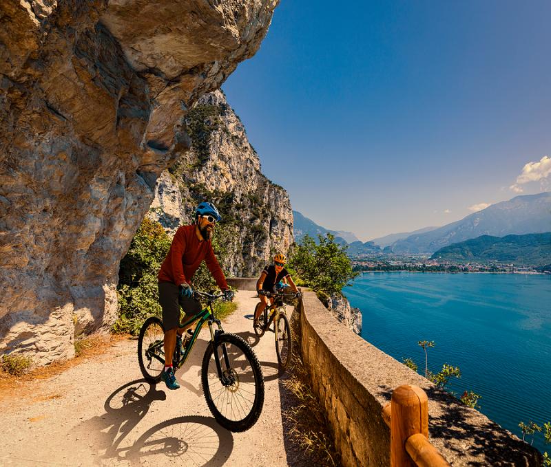 Two bikers on Lake Garda bike path