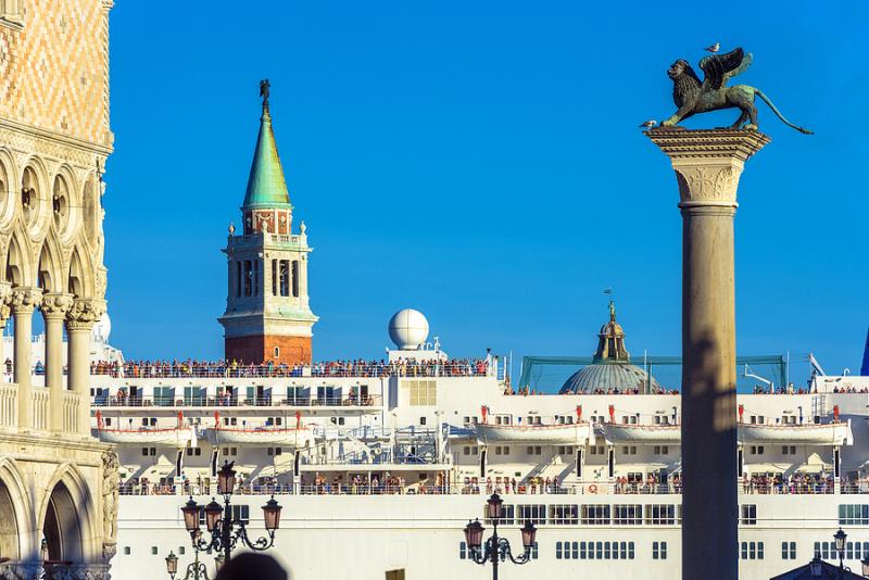 Large cruise ship sails past St. Mark's Square in Venice