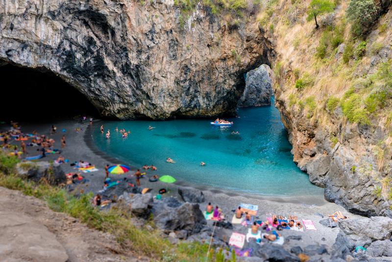 Italian beach called Arcomagno in calabria ionian sea with rocks natural arch