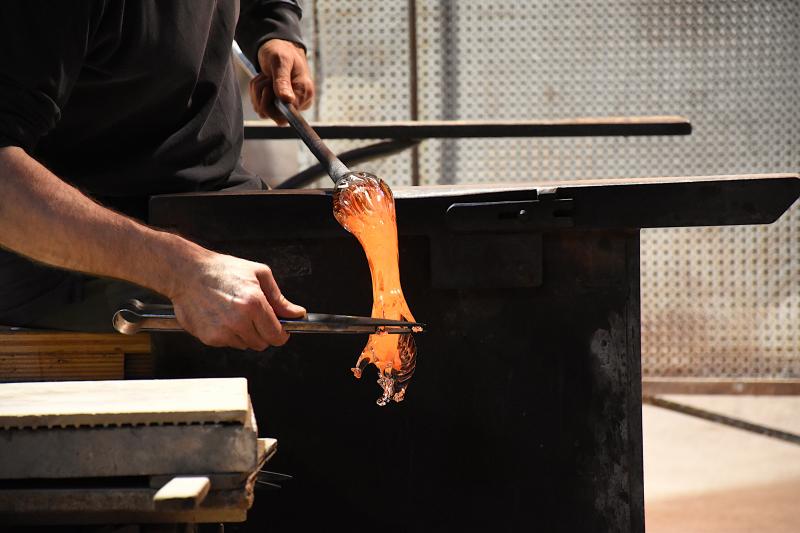 Glass blower forming a decorative glass horse at a traditional Murano glass manufactory / Photo: BalazsSebok via Shutterstock