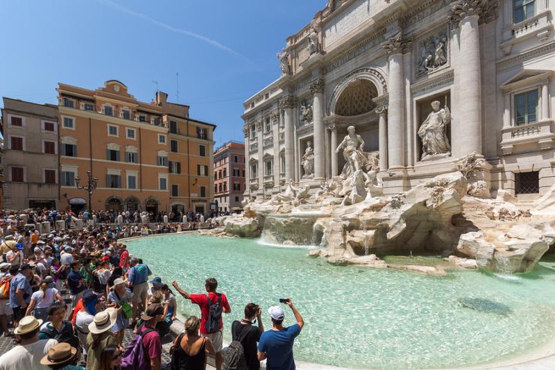 Tourist crowds in front of the Trevi Fountain in Rome