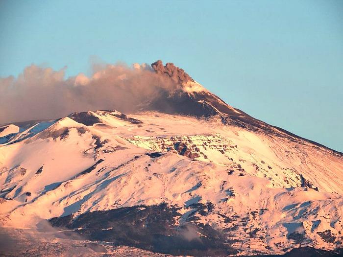 Mount Etna erupting under the snow